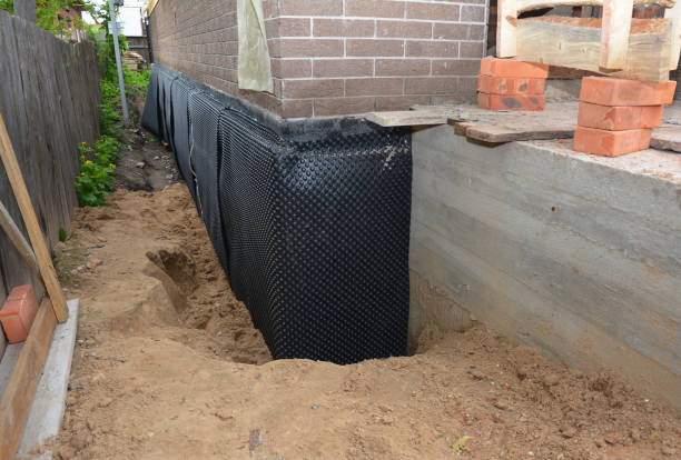 Happy homeowners after waterproofing job in Amo